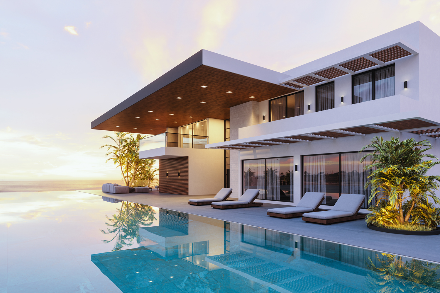 Modern villa with pool at sunset.