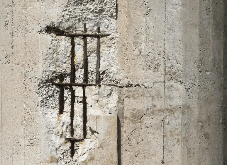 Weathered concrete with visible rebar
