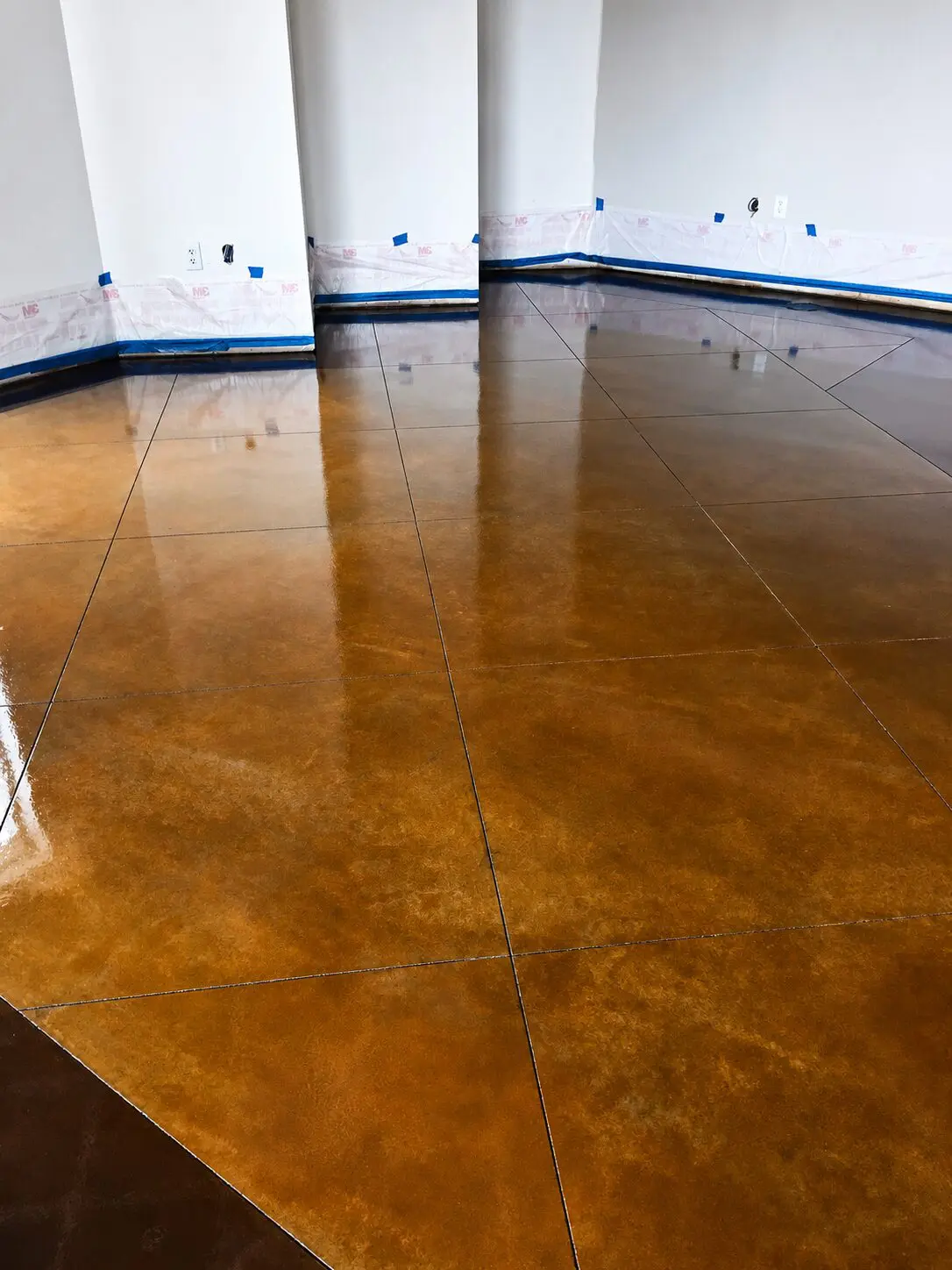 Shiny brown-stained concrete floor
