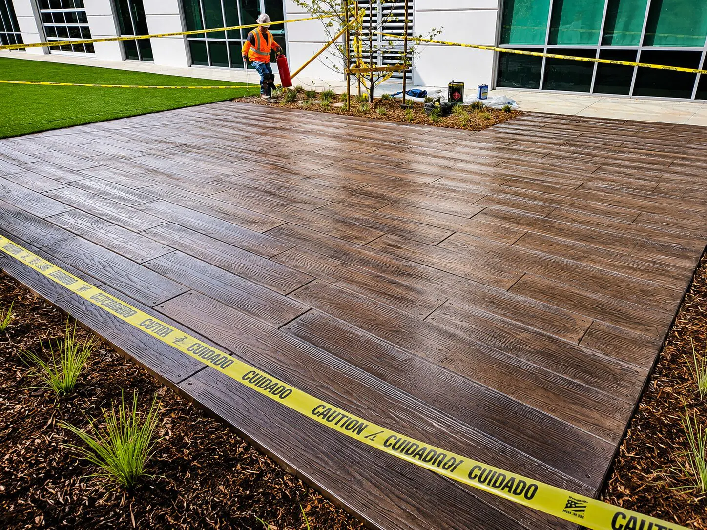 Worker near freshly installed wooden deck