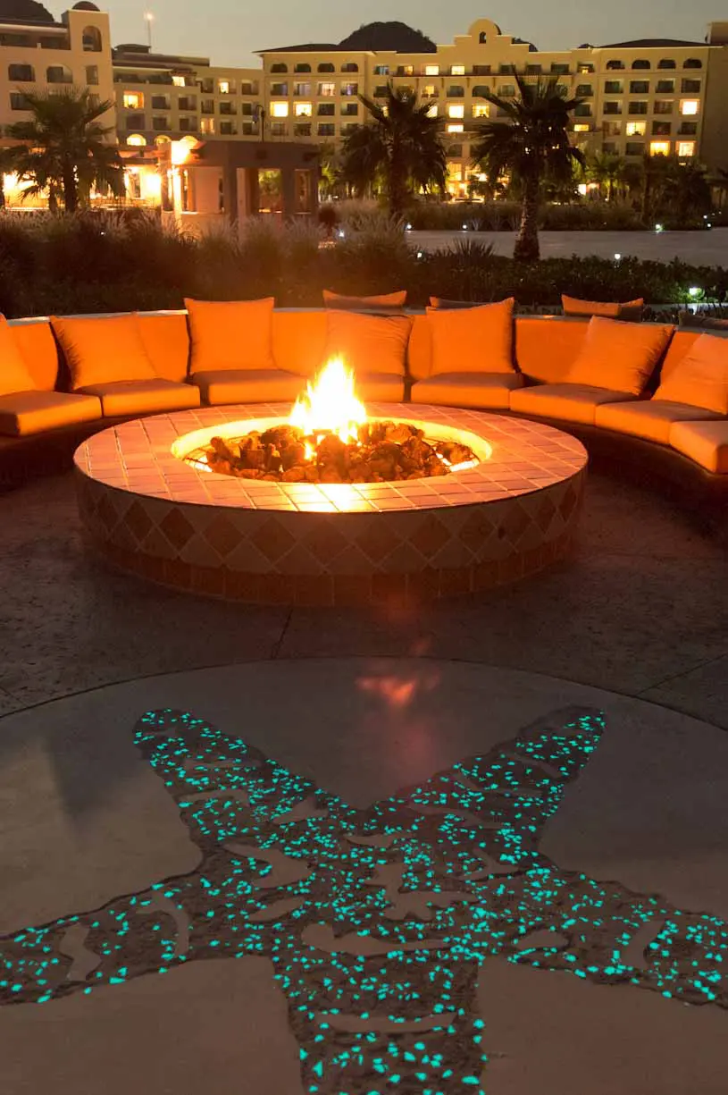 Nighttime patio with illuminated fire pit