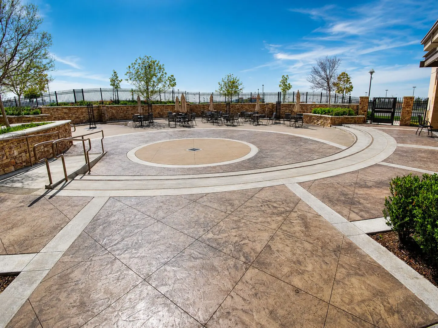 Spacious courtyard with pavers and trees