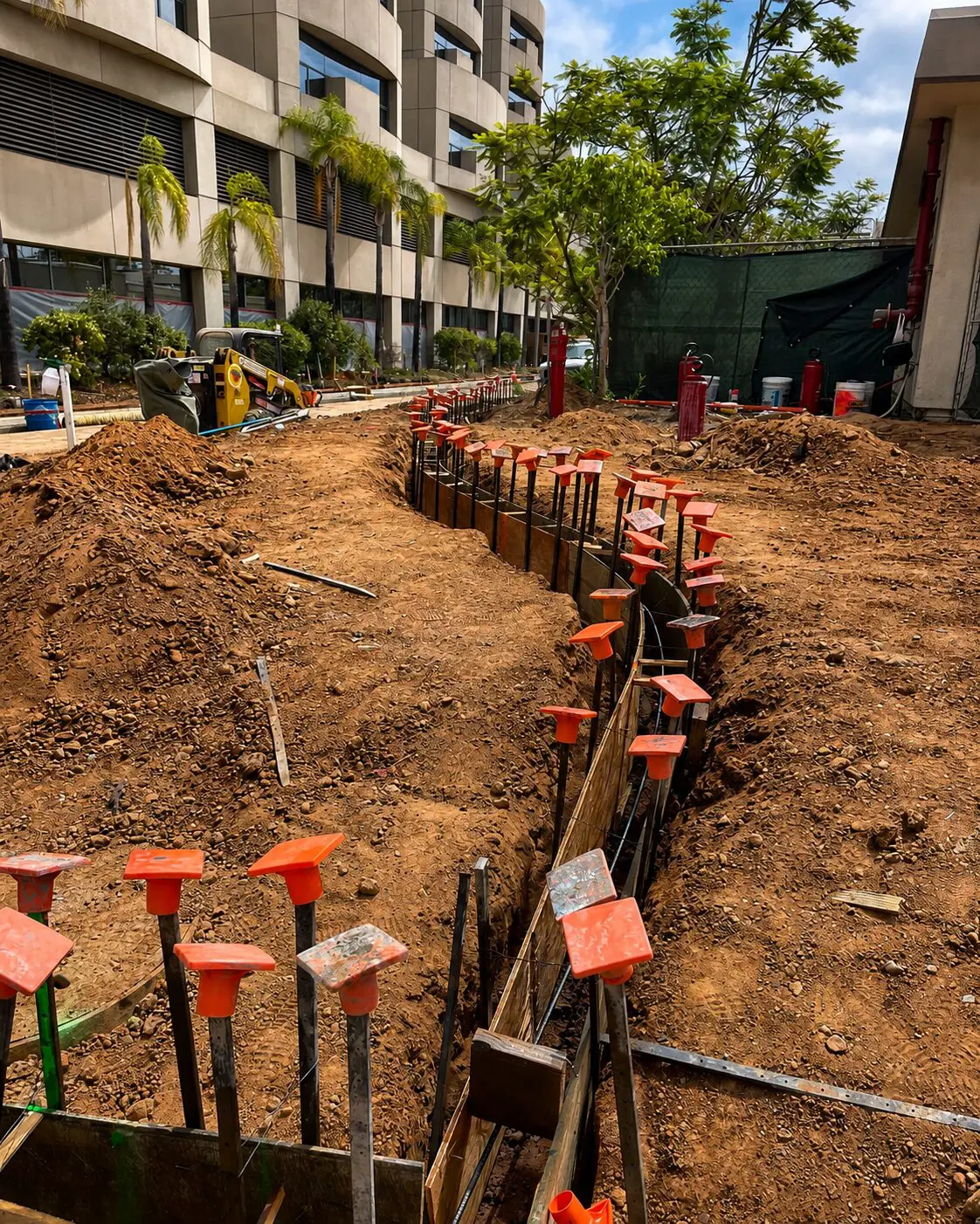 Digging site near modern office building