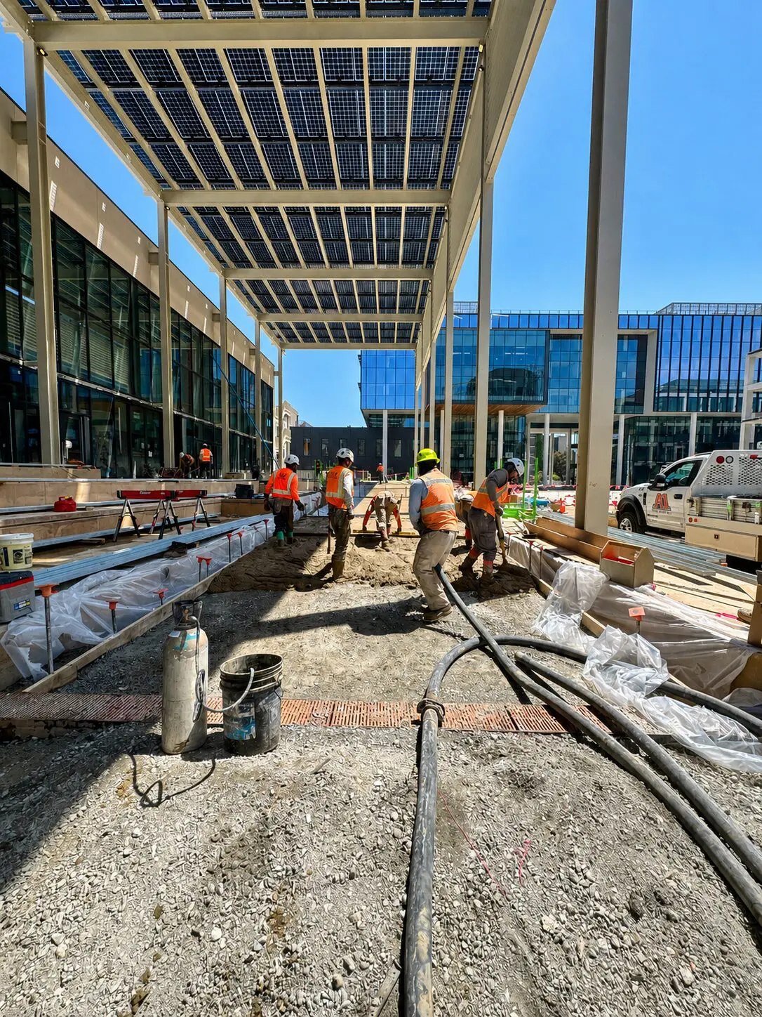 Construction workers building outdoor walkway