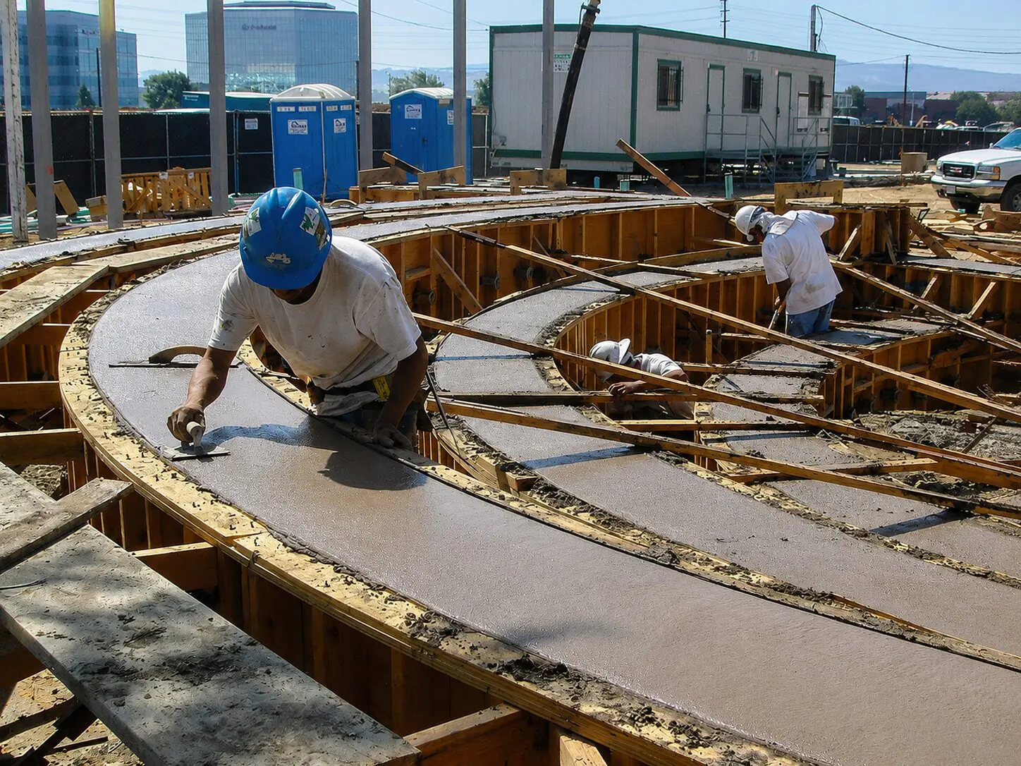 Building crew working with fresh concrete