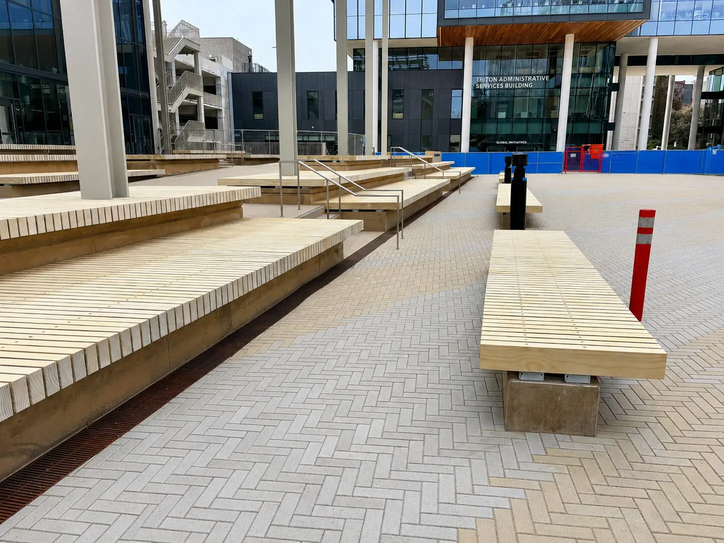 Urban plaza featuring wooden benches