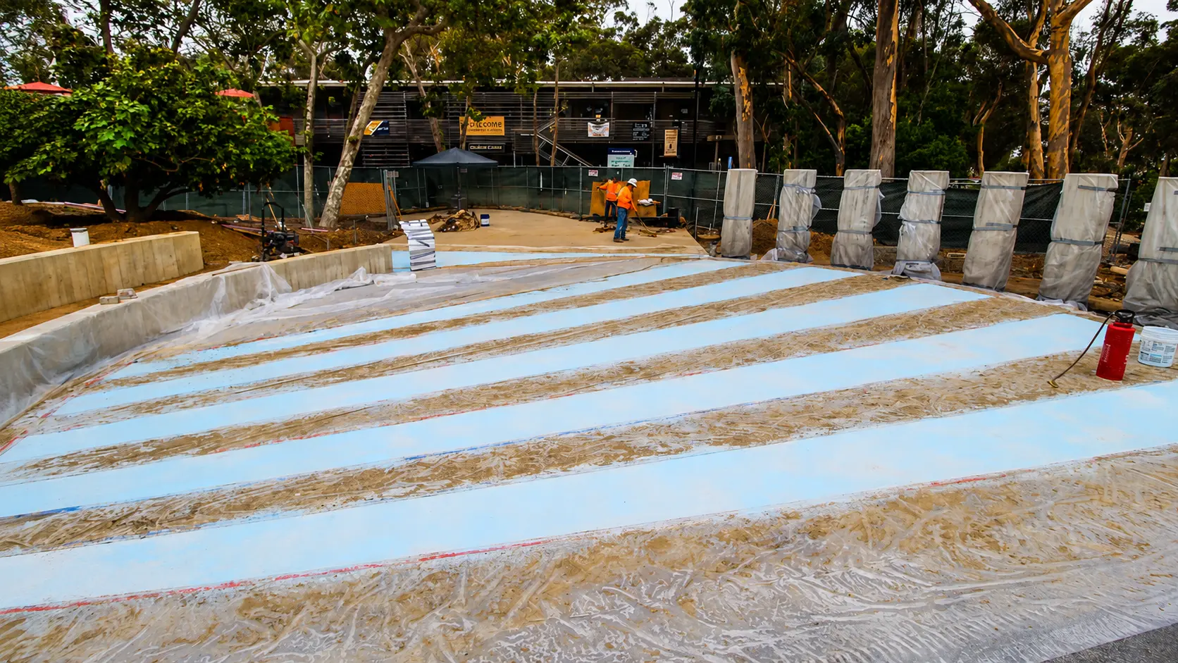 Workers at construction site with equipment