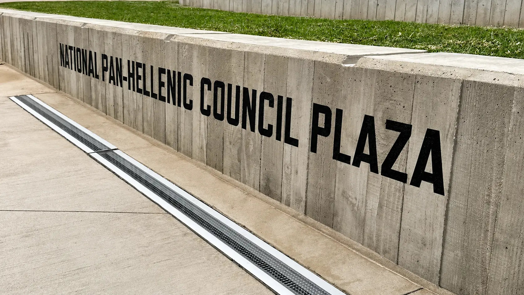 Concrete wall with plaza name