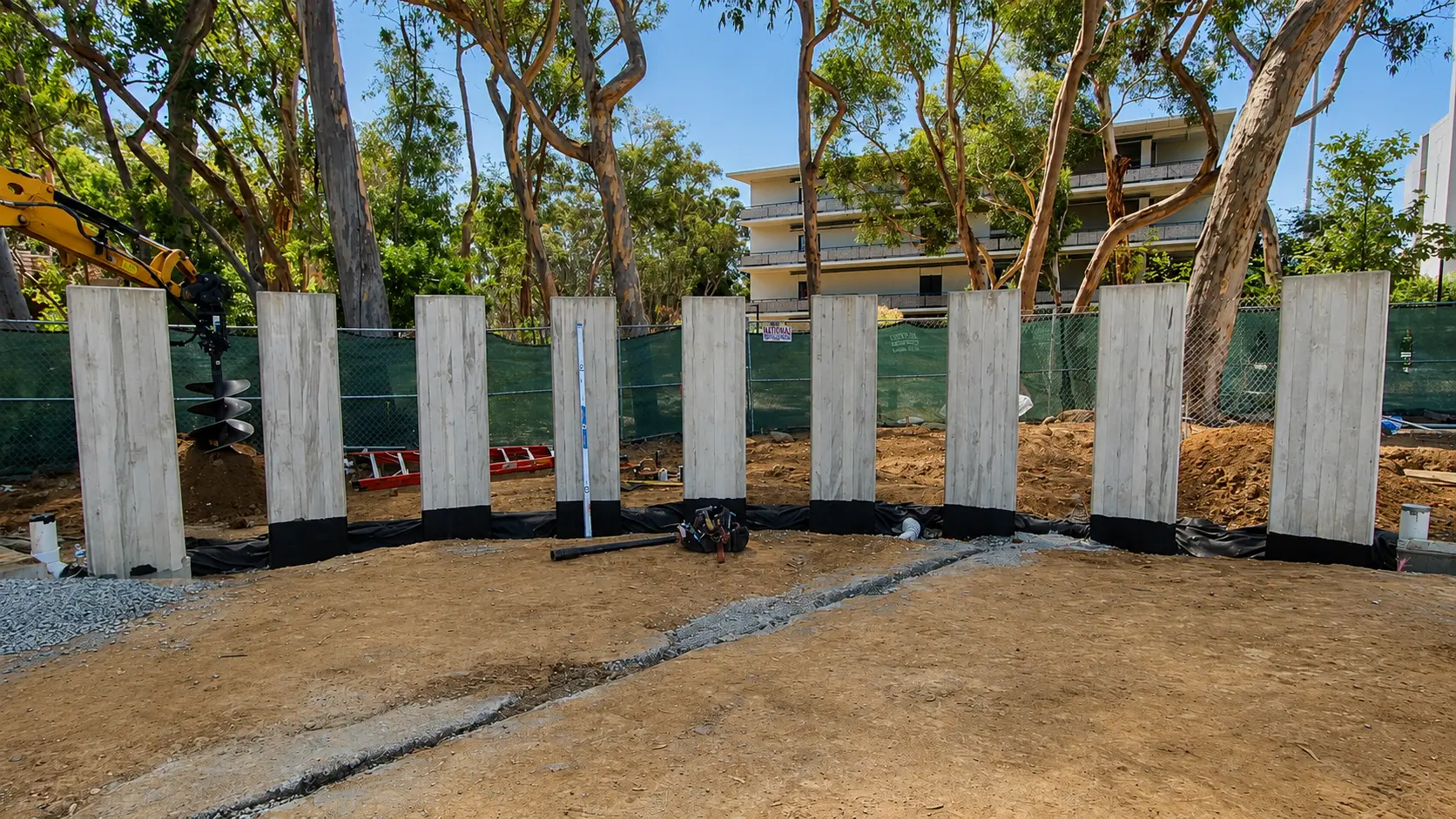 Vertical slabs with trees in background