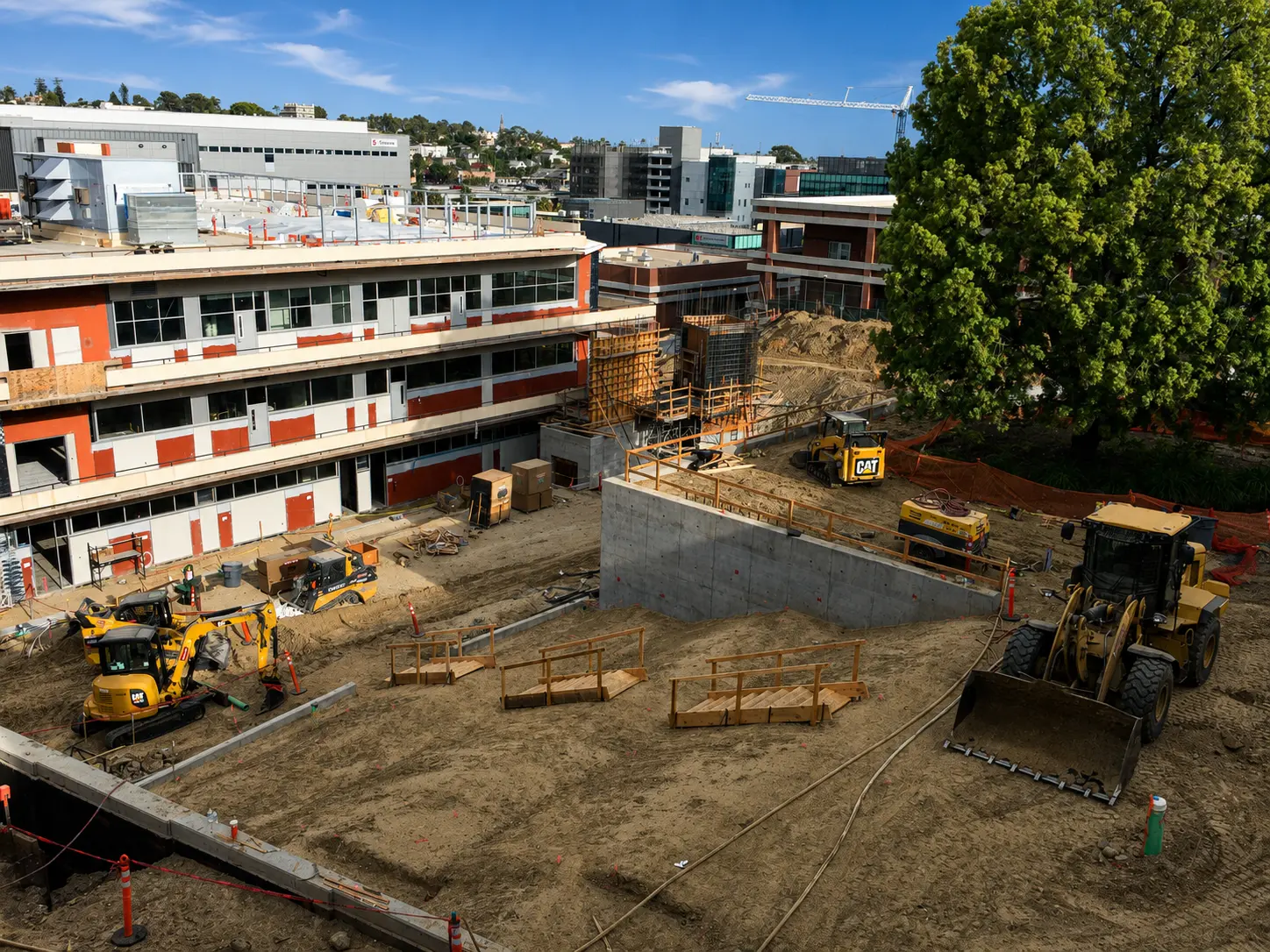 Construction site with machinery and buildings
