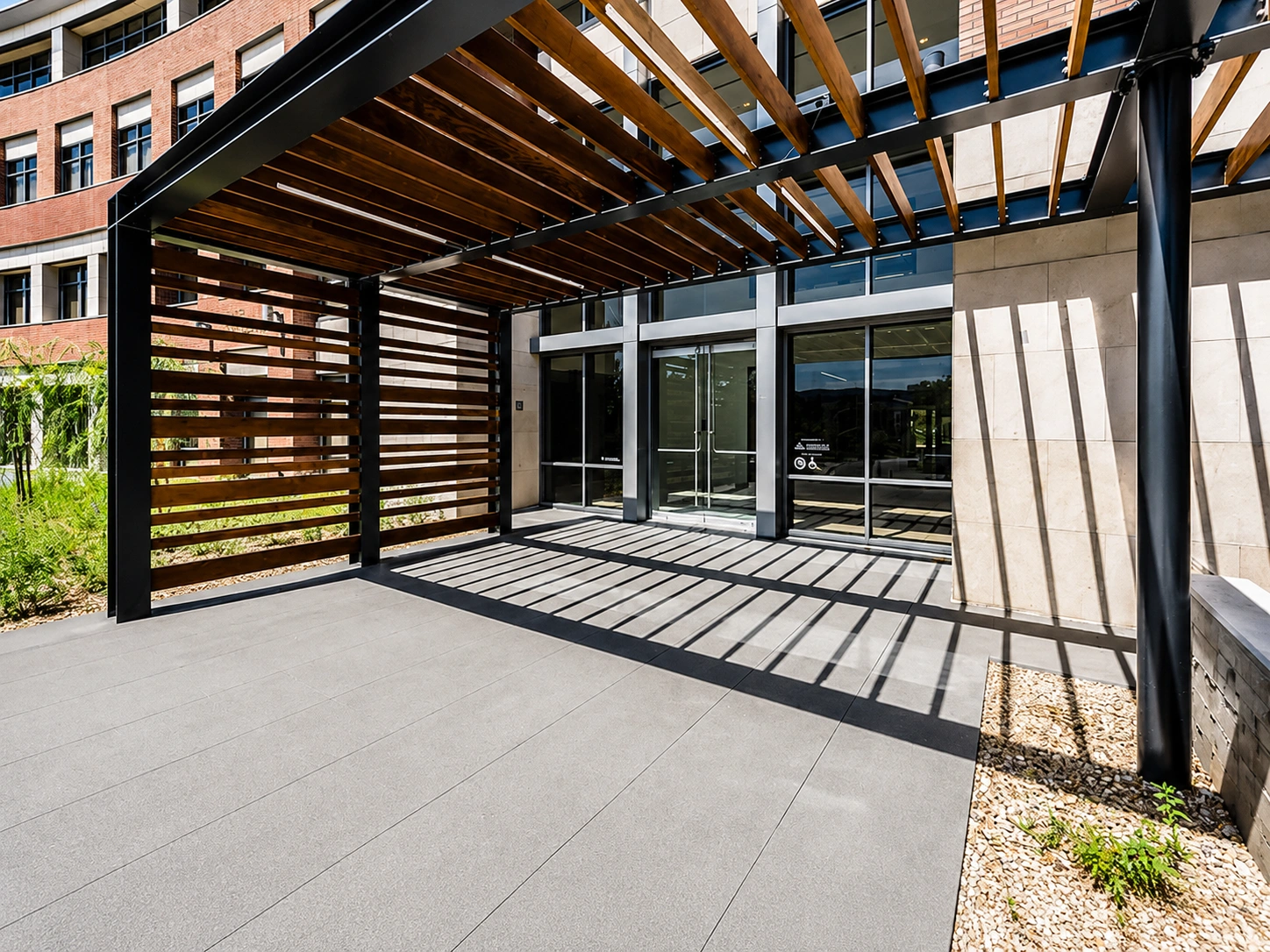 Modern building entrance with wooden pergola
